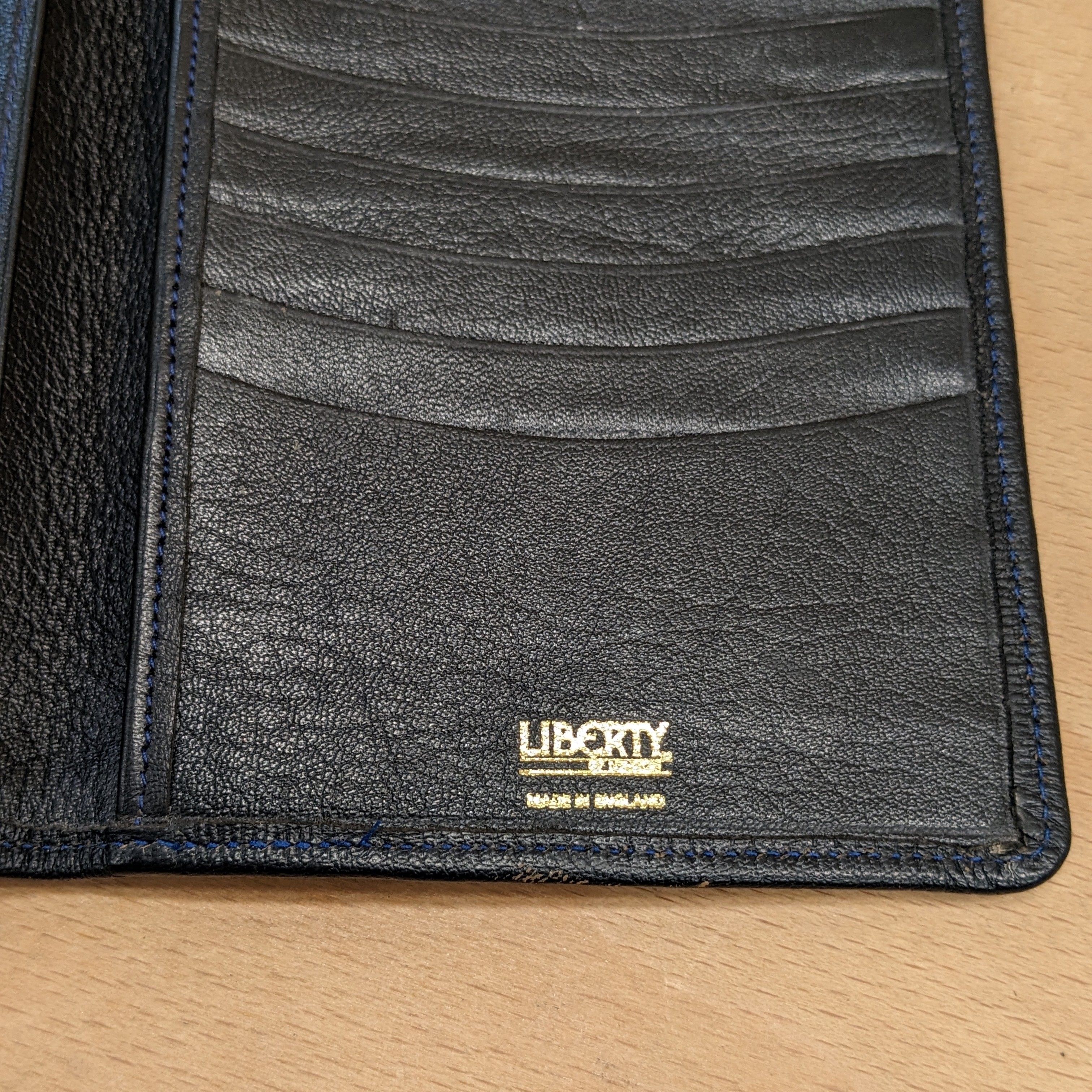 Liberty of London card holder close up view of brand logo inside holder